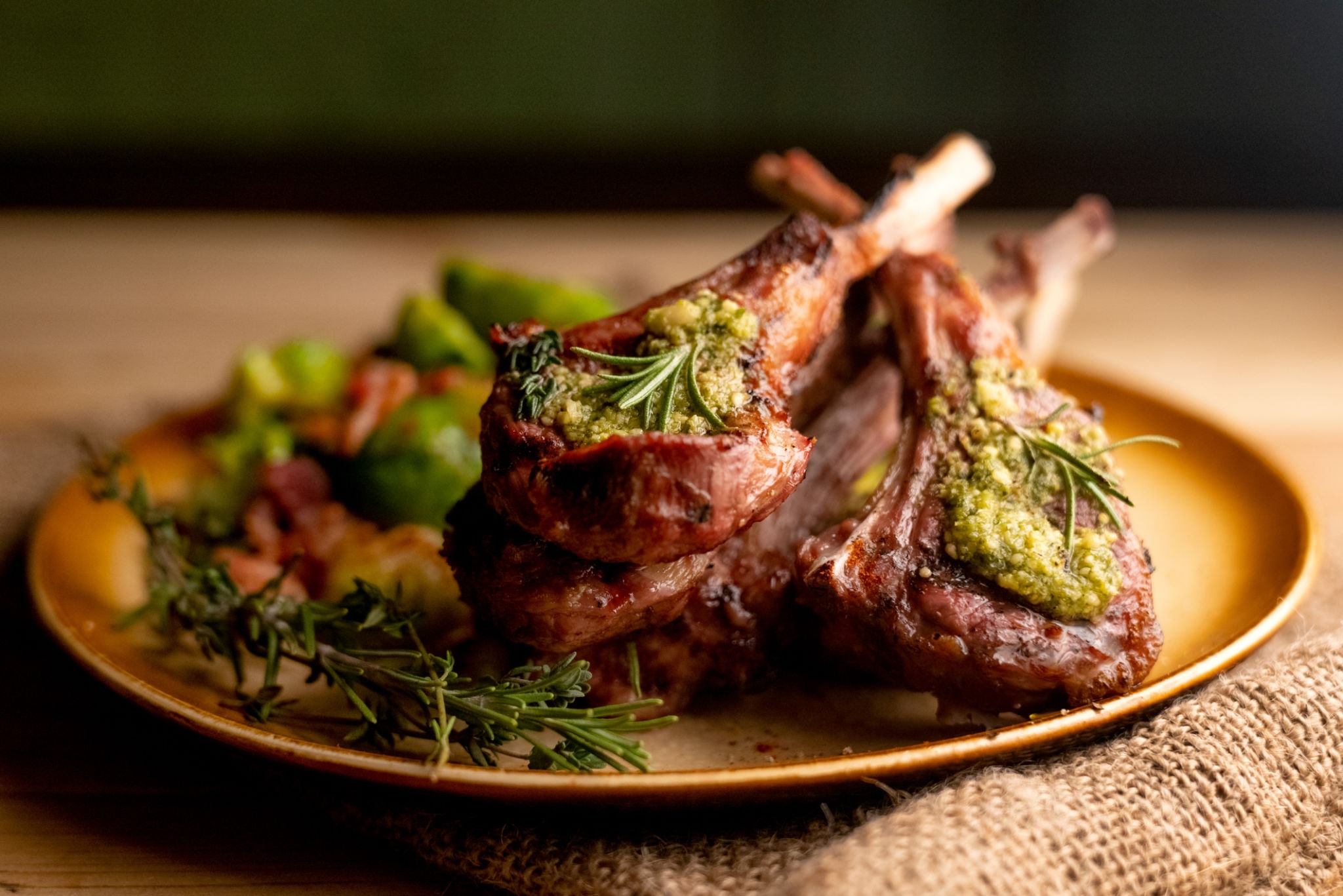 Herb-crusted lamb chops with rosemary and seasonal vegetables